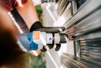 Professional fence contractor working on a residential fencing project in Melville WA.