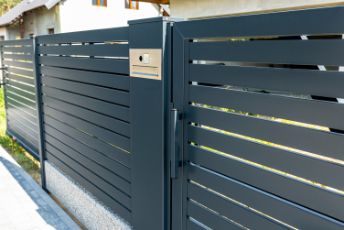 Newly installed black painted metal automatic gate in a residential property in Melville WA.