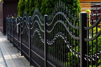 Black painted metal fence in a huge residential property for protection in Melville WA.