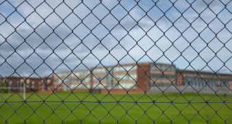 School with chain link fencing all around the vicinity in Melville WA for safety.