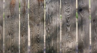 Newly installed textured natural wood fence in a residential backyard garden in Melville WA.