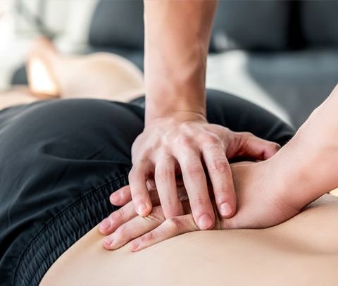 Therapist Giving Lower Back Sports Massage — Mechanicsburg, VA — Molto Bella Salon