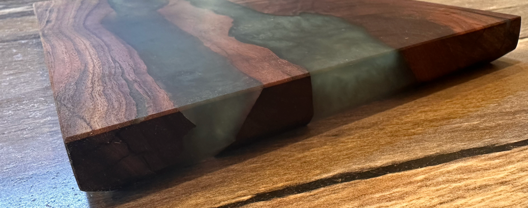 Curled Walnut Charcuterie board with turquoise expoxy
