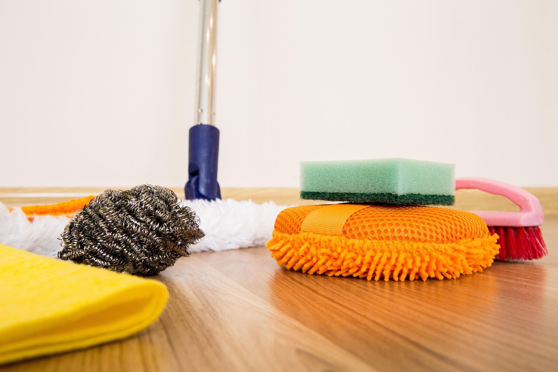 Tools used for residential cleaning, mop, sponges, microfiber cloths, cleaning brushes, brillo pad