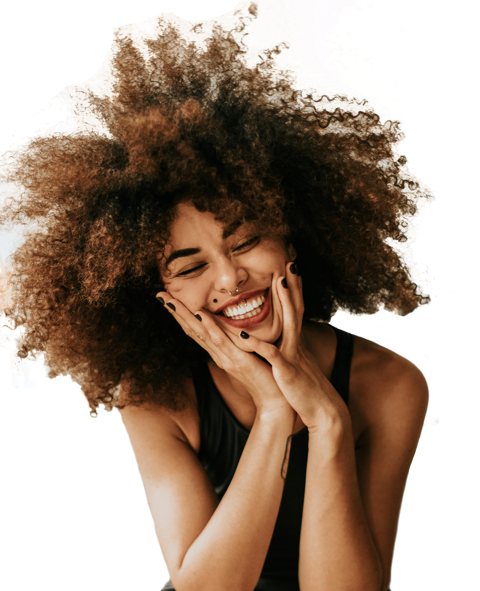 Young woman smiling and touching her face