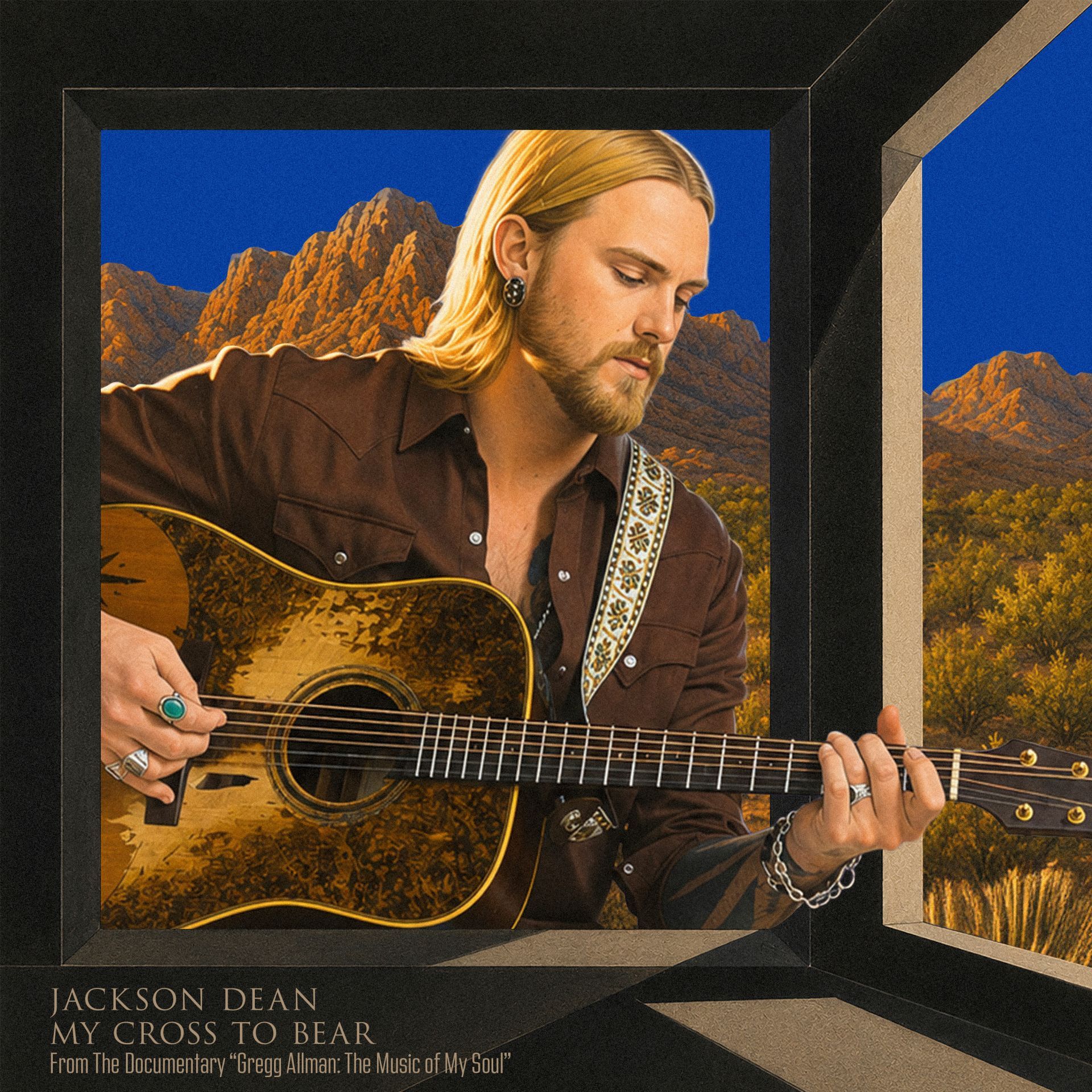 Musician playing acoustic guitar against a desert backdrop, framed like an album cover