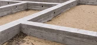 Concrete foundation of a building under construction, with a sand interior.