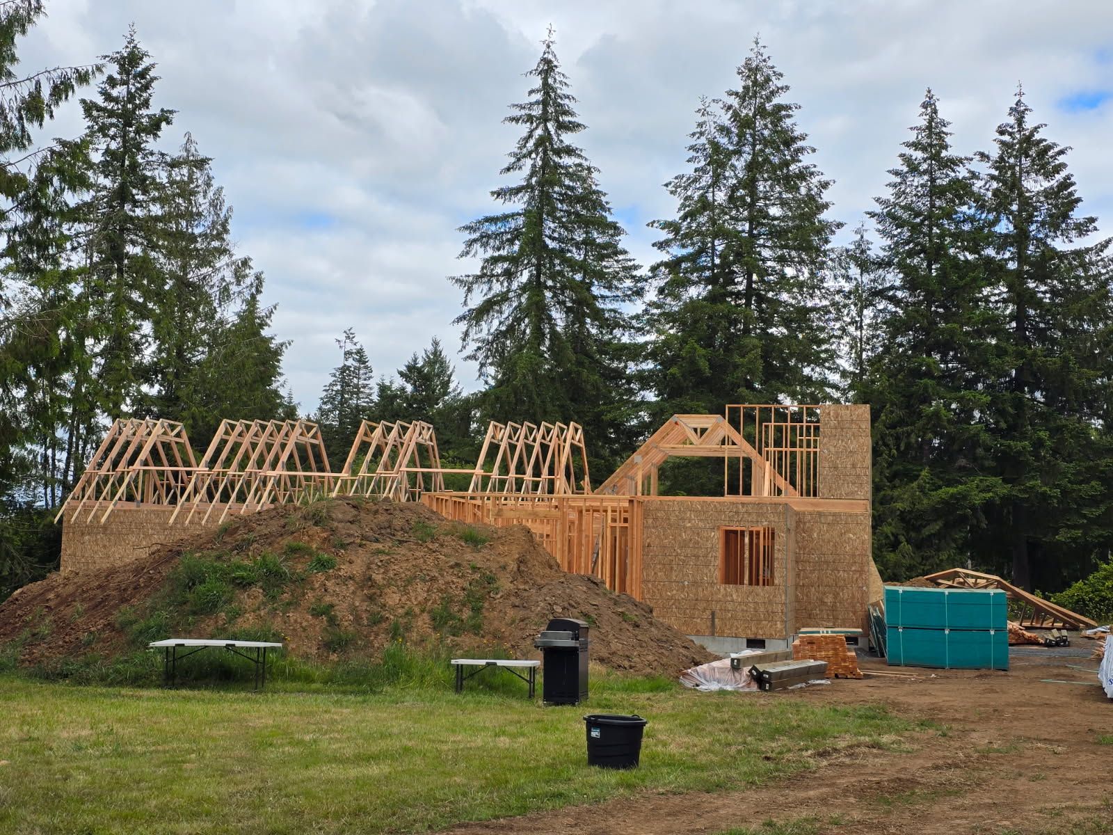Wooden floor with sunlight reflecting off its polished surface, along a wood baseboard in a corner of a room.
