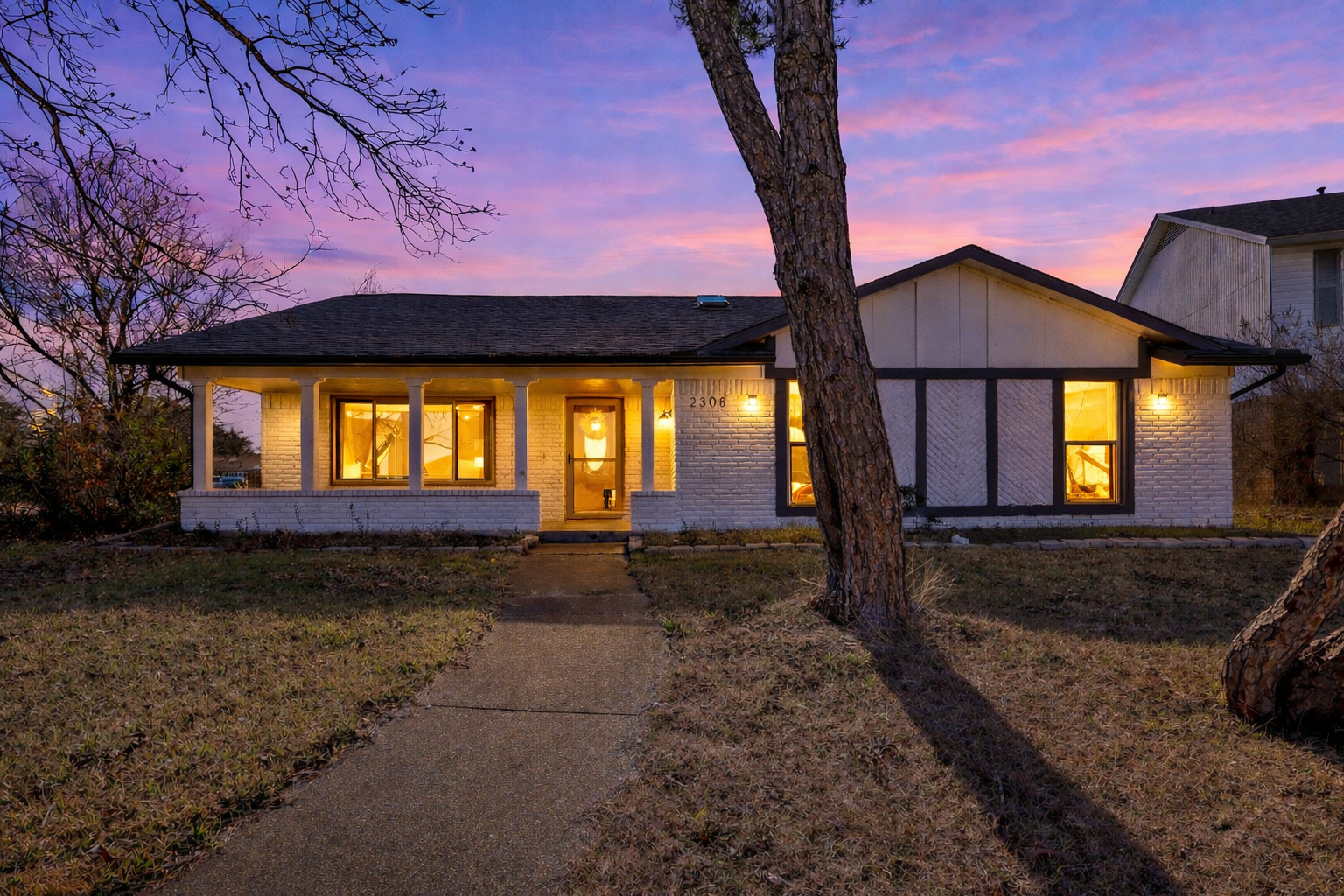 A living room with a couch , two coffee tables and a mirror.