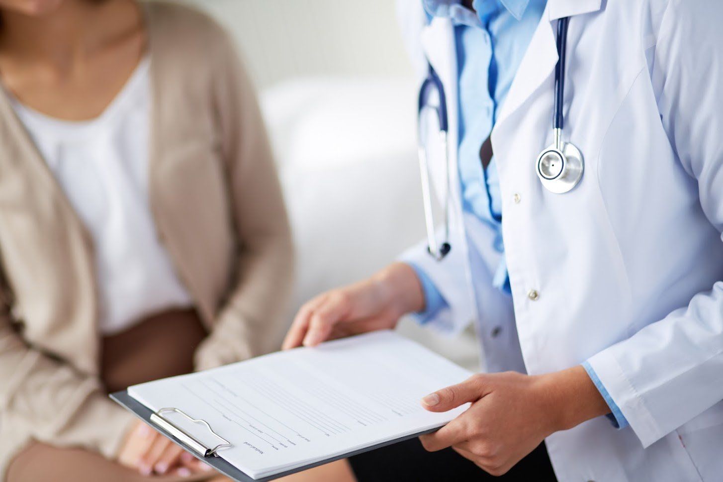 Woman Consulting a Doctor — Louisville, KY — Kentuckiana Gastroenterology & Paramount Surgery Center