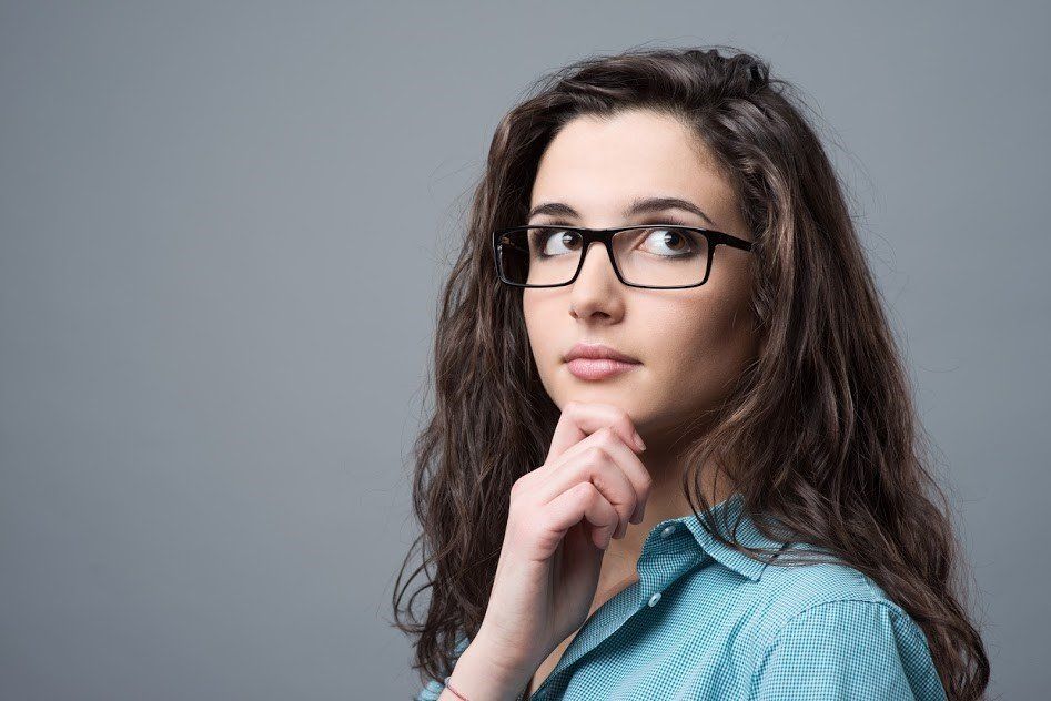 Woman Wearing Glasses Thinking — Louisville, KY — Kentuckiana Gastroenterology