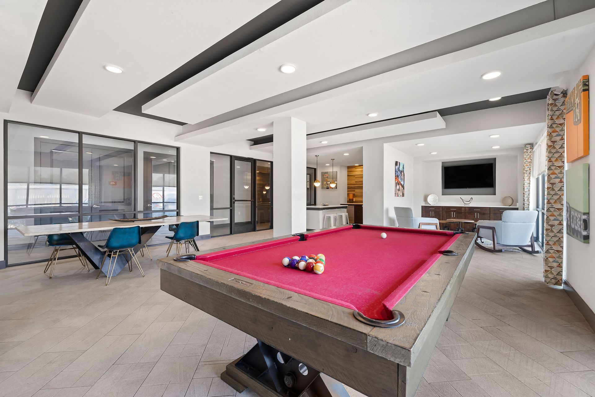 A pool table in the middle of the game room for convenient student living at The Heights offers SHSU student apartments for rent.