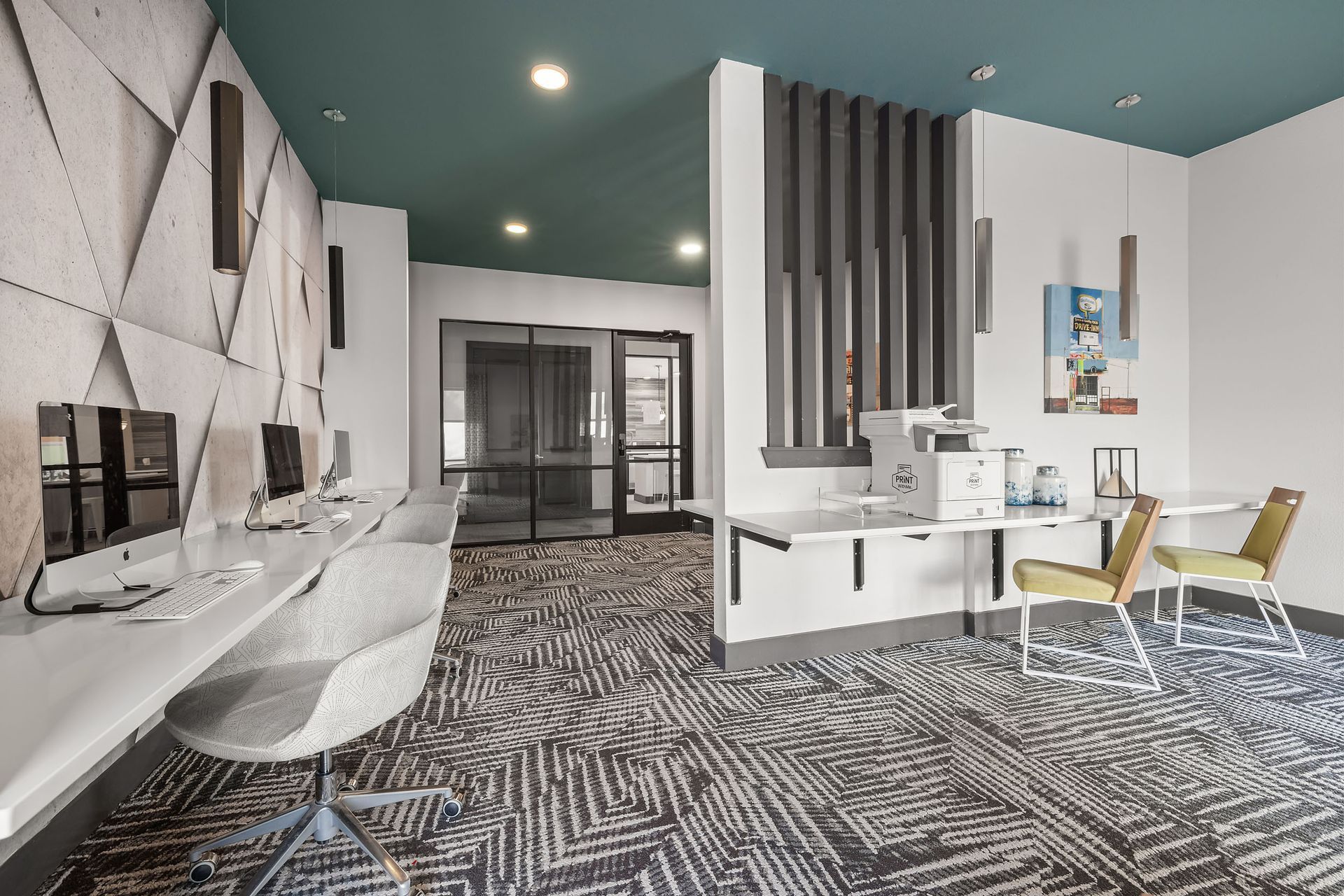 An artist's impression of a study room with computers, printers, desks and chairs at The Heights offers student apartments near SHSU.