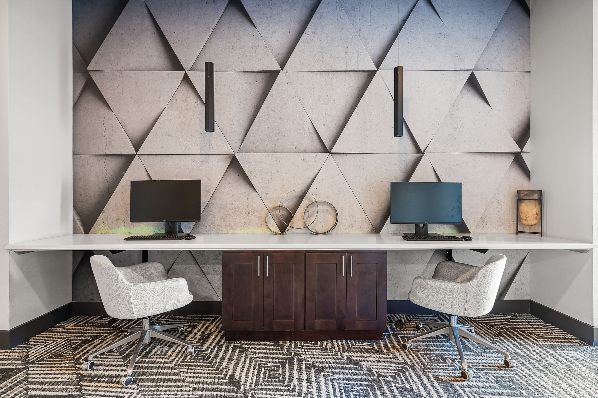 Cyber Cafe with computer desk with two chairs and two computers on it at The Heights offers student apartments for rent near SHSU in Huntsville, TX.