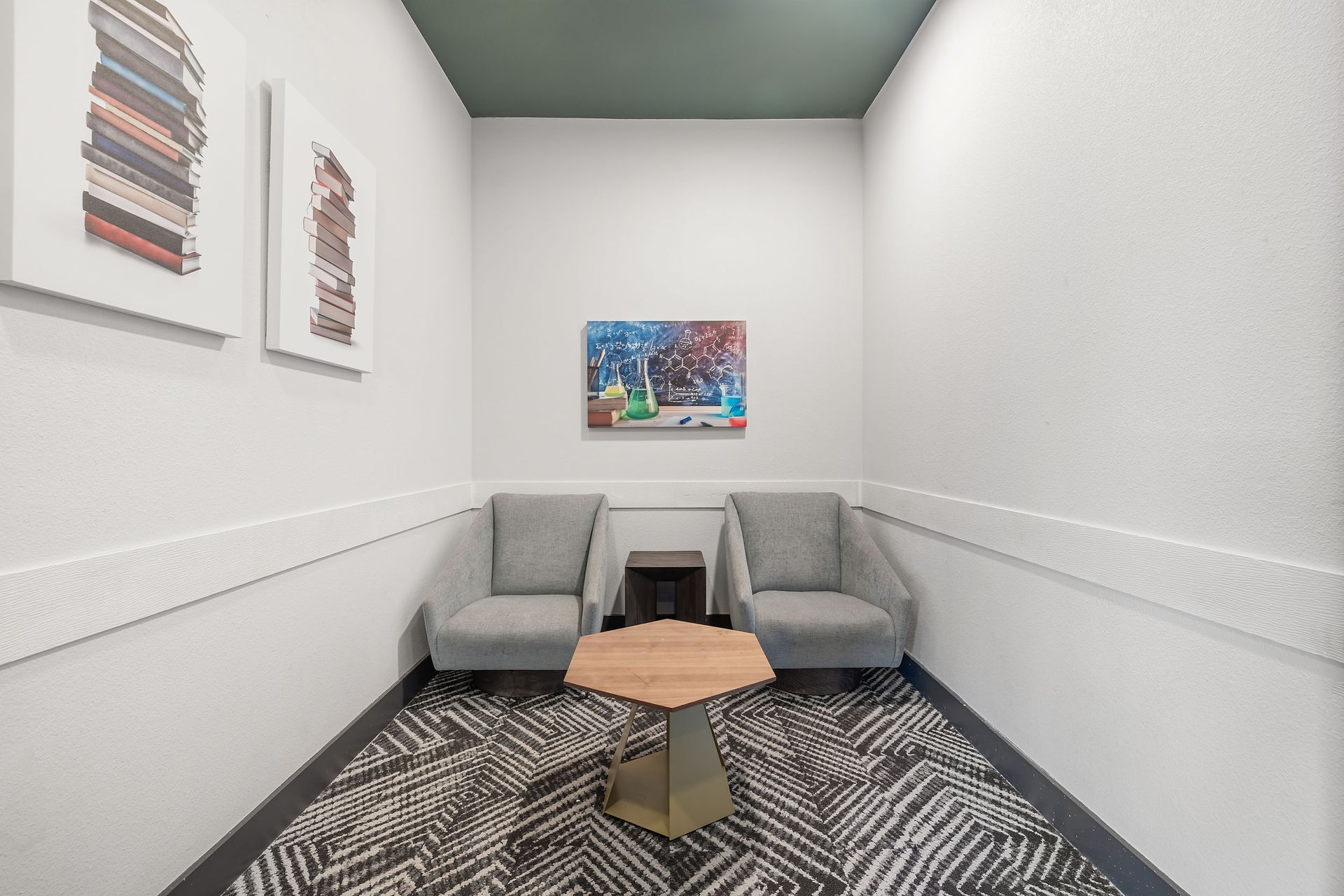 Cyber Cafe with two chairs and a table in it at The Heights offers student apartments for rent near SHSU in Huntsville, TX.