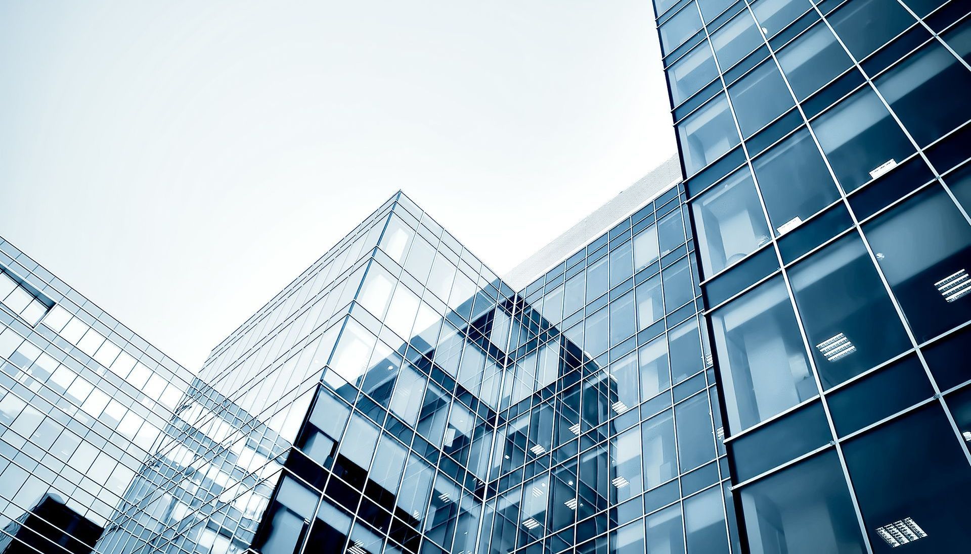 Looking up at a tall building with lots of windows