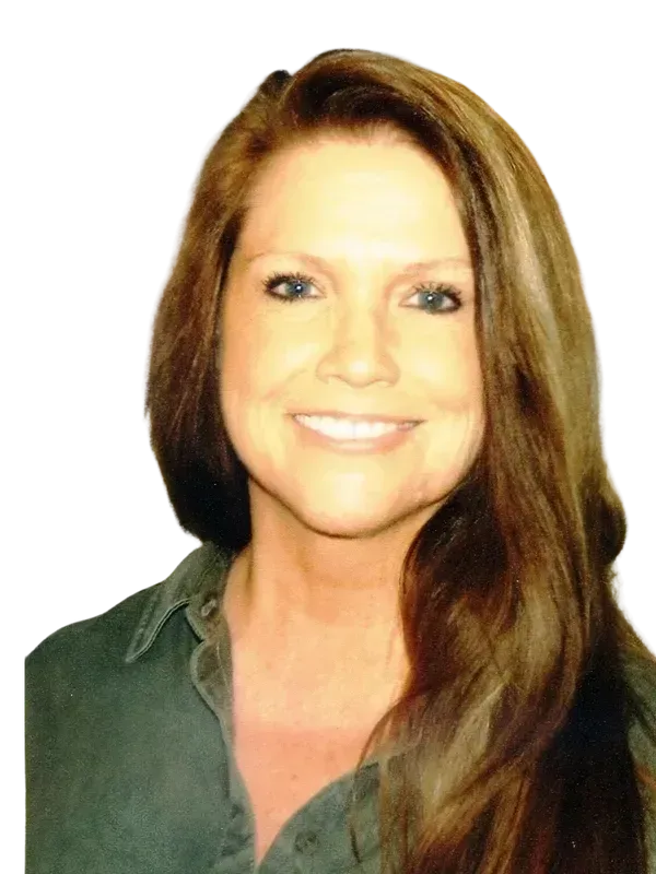 Woman with long brown hair smiles, wearing a green shirt.