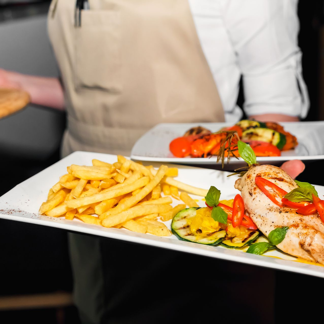 A woman is helping an elderly man with a cane in a grocery store.