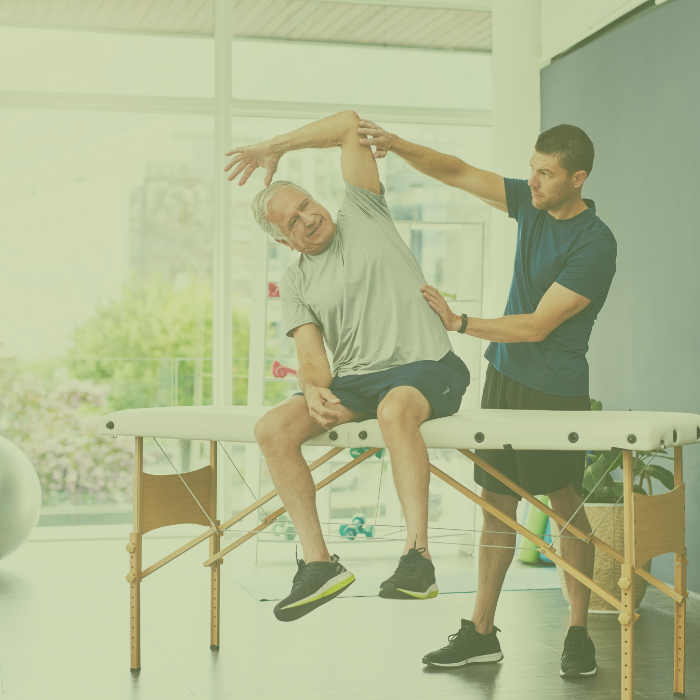 Physical Therapist working with client at Champion Rehab