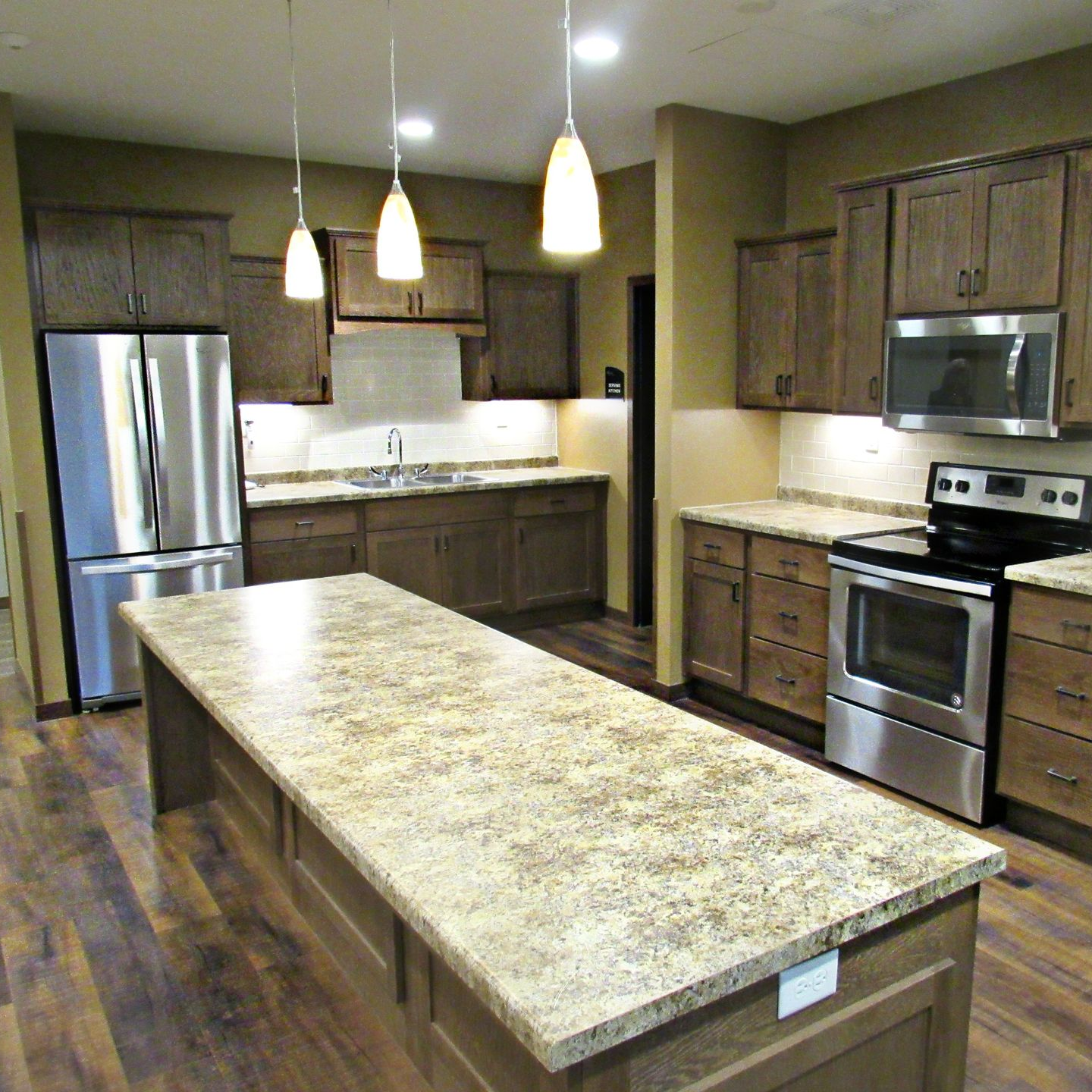 A man and a woman are sitting on a couch talking to each other