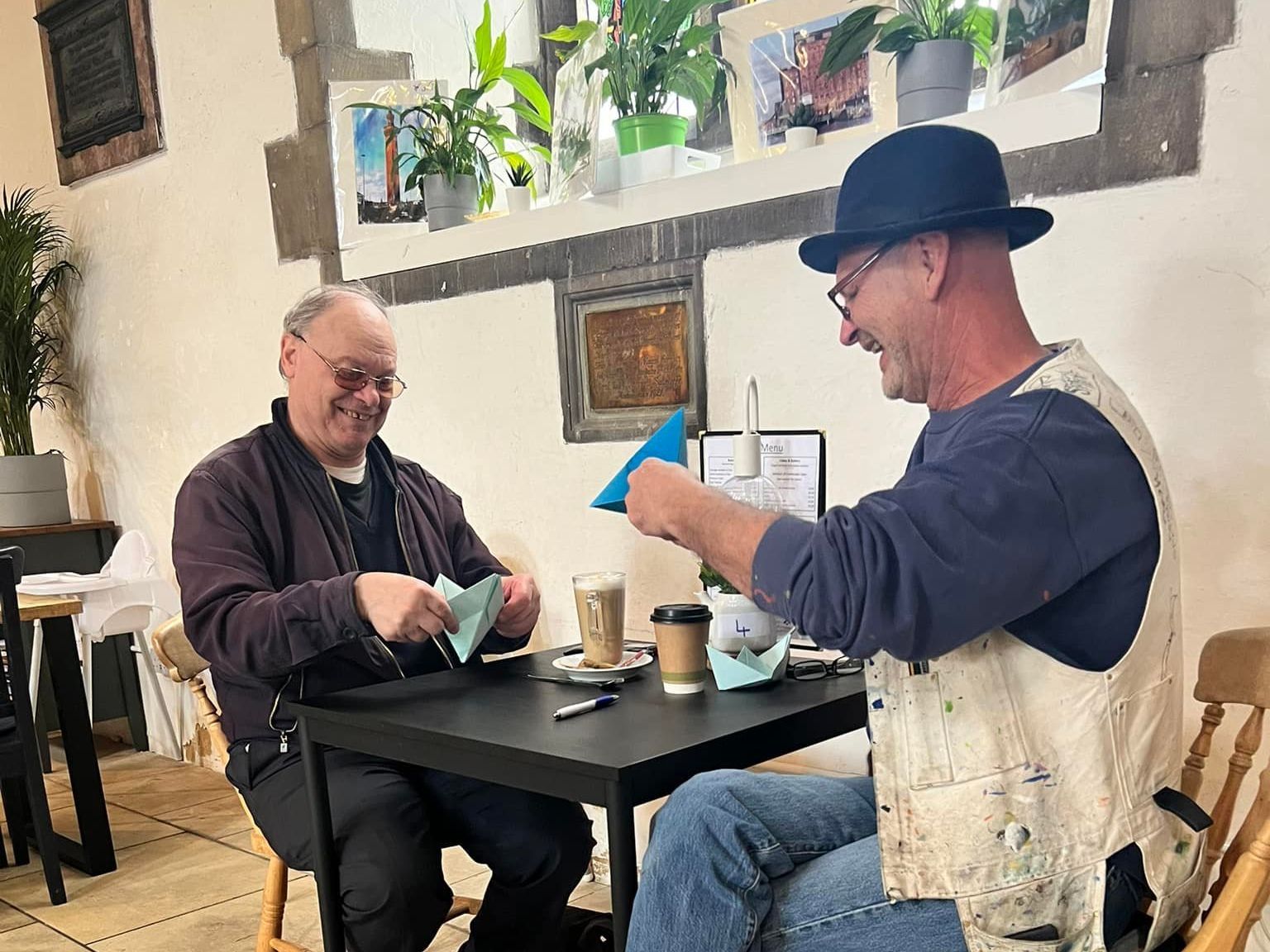 Two men are sitting at a table