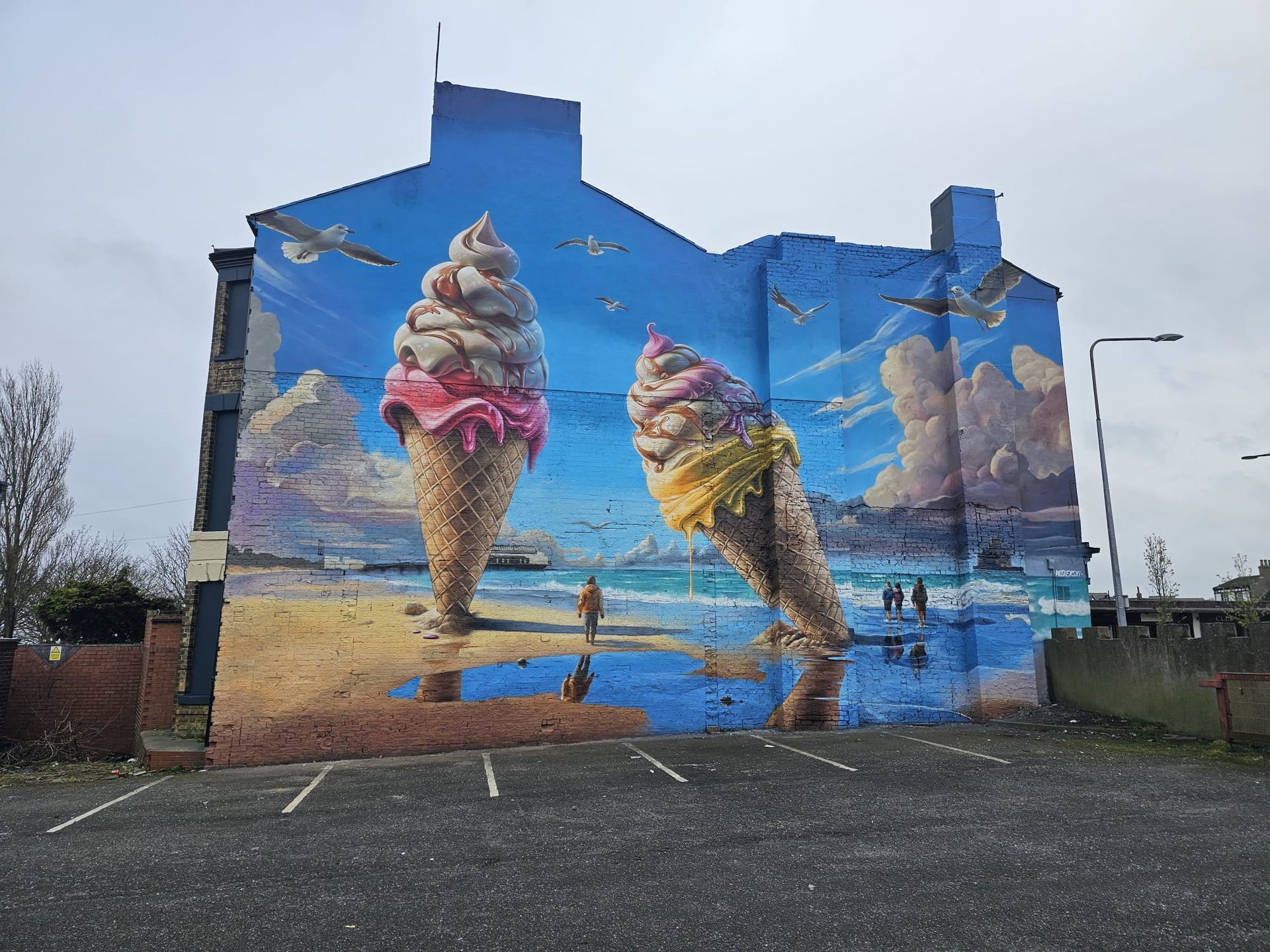 A large mural of ice cream cones on the side of a building.