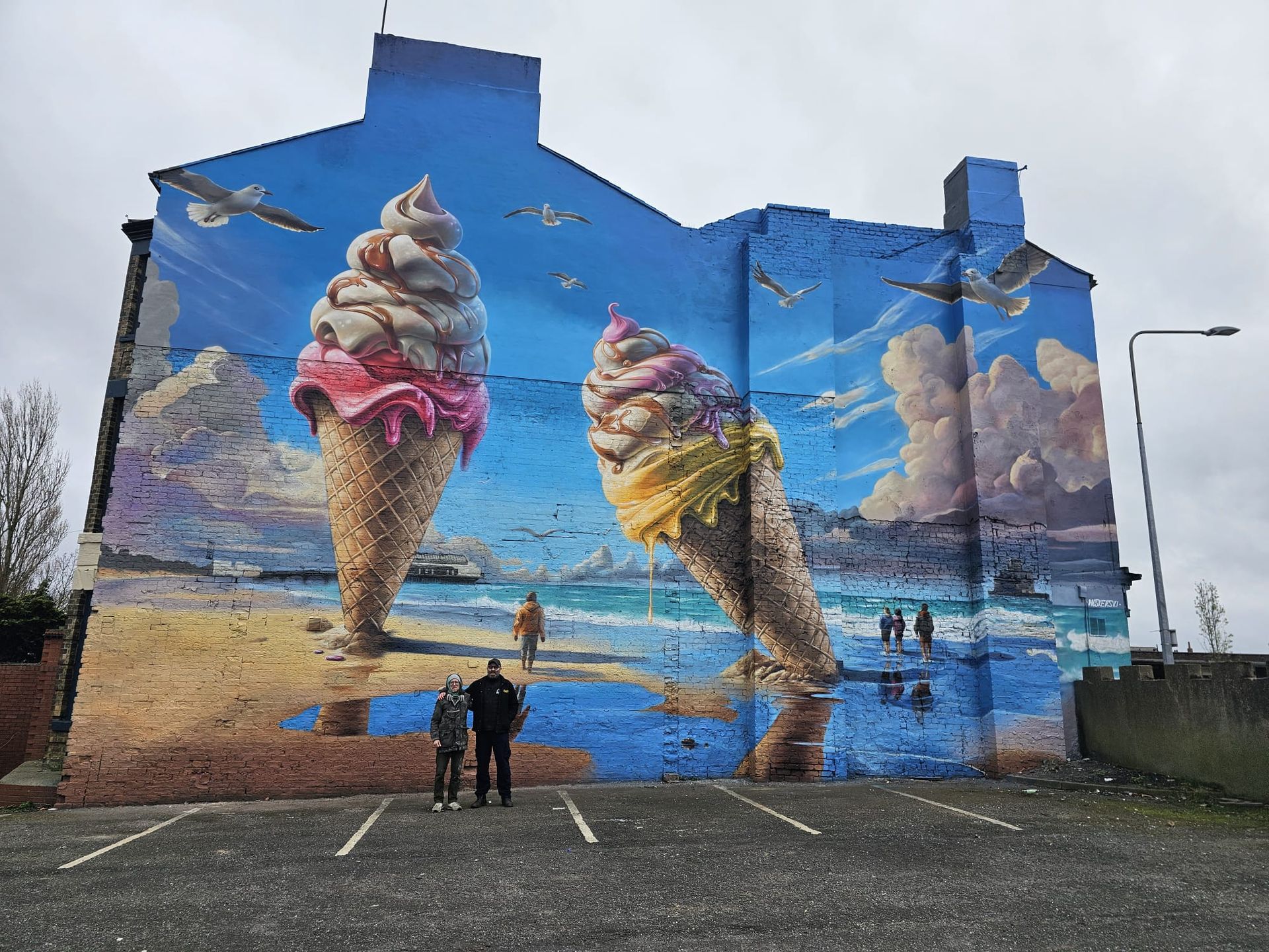 A large mural of ice cream cones on the side of a building.
