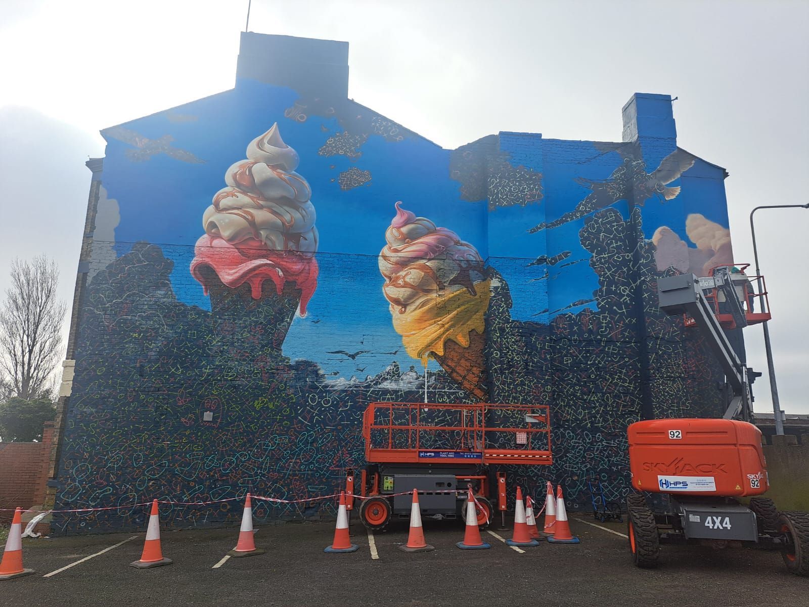 A large mural of ice cream cones on the side of a building