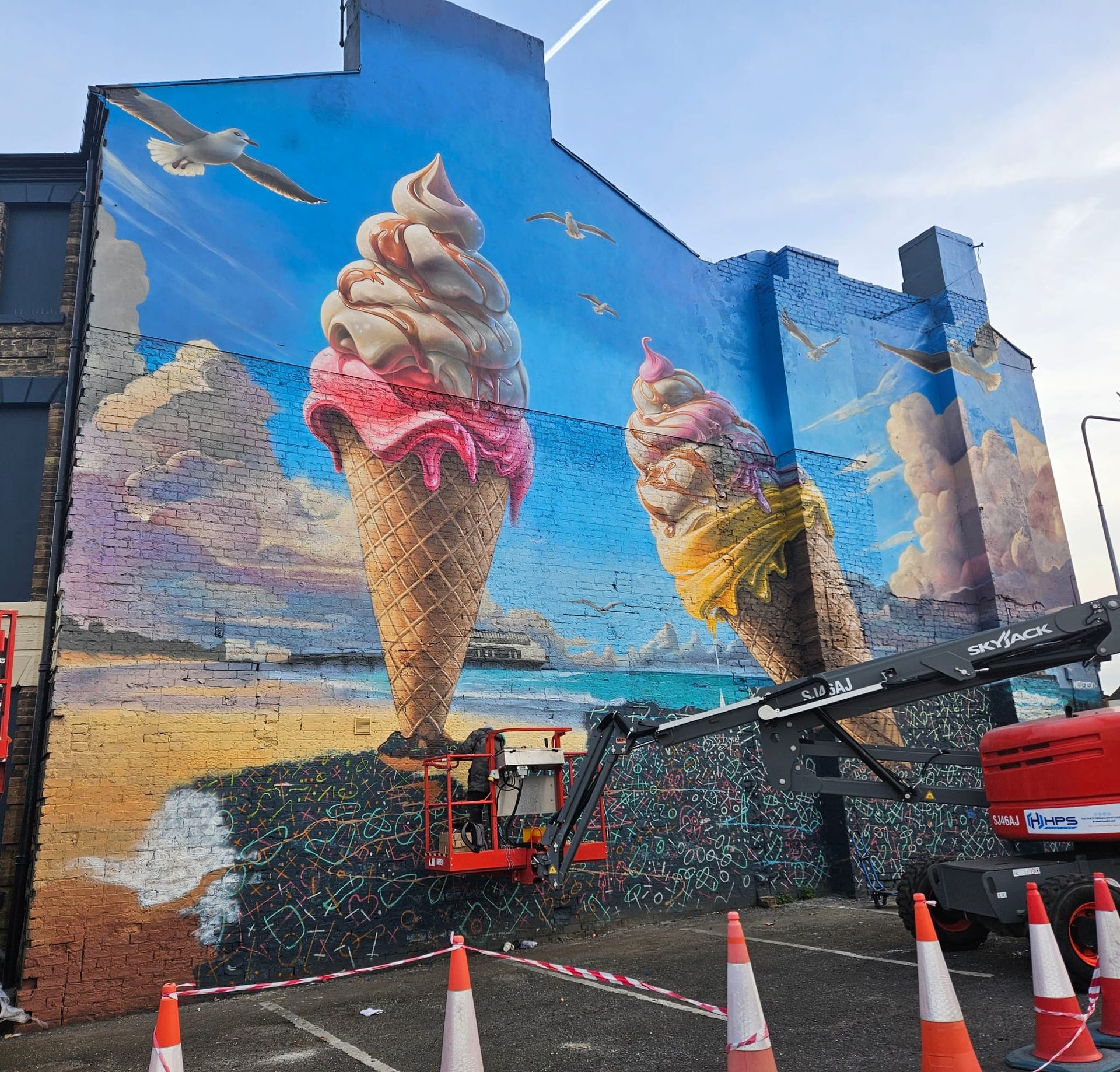 A large mural of ice cream cones on the side of a building