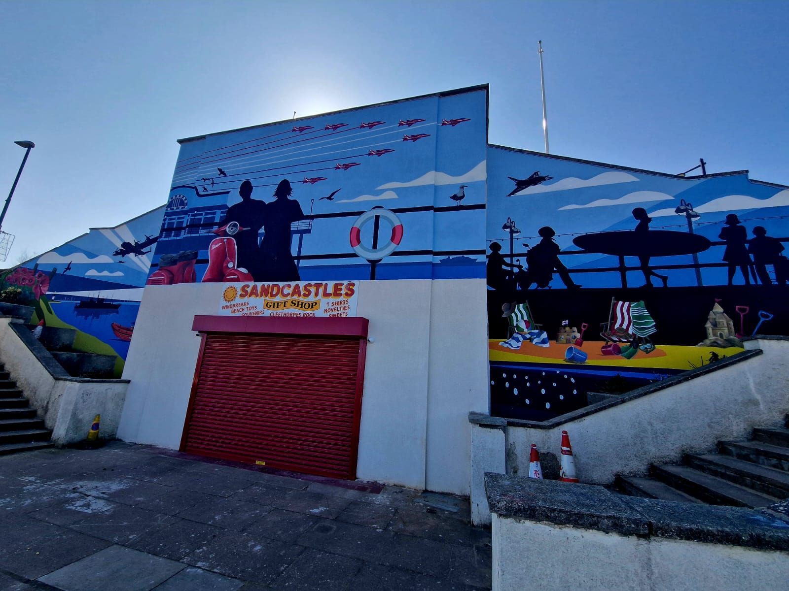 A building with a large mural on the side of it