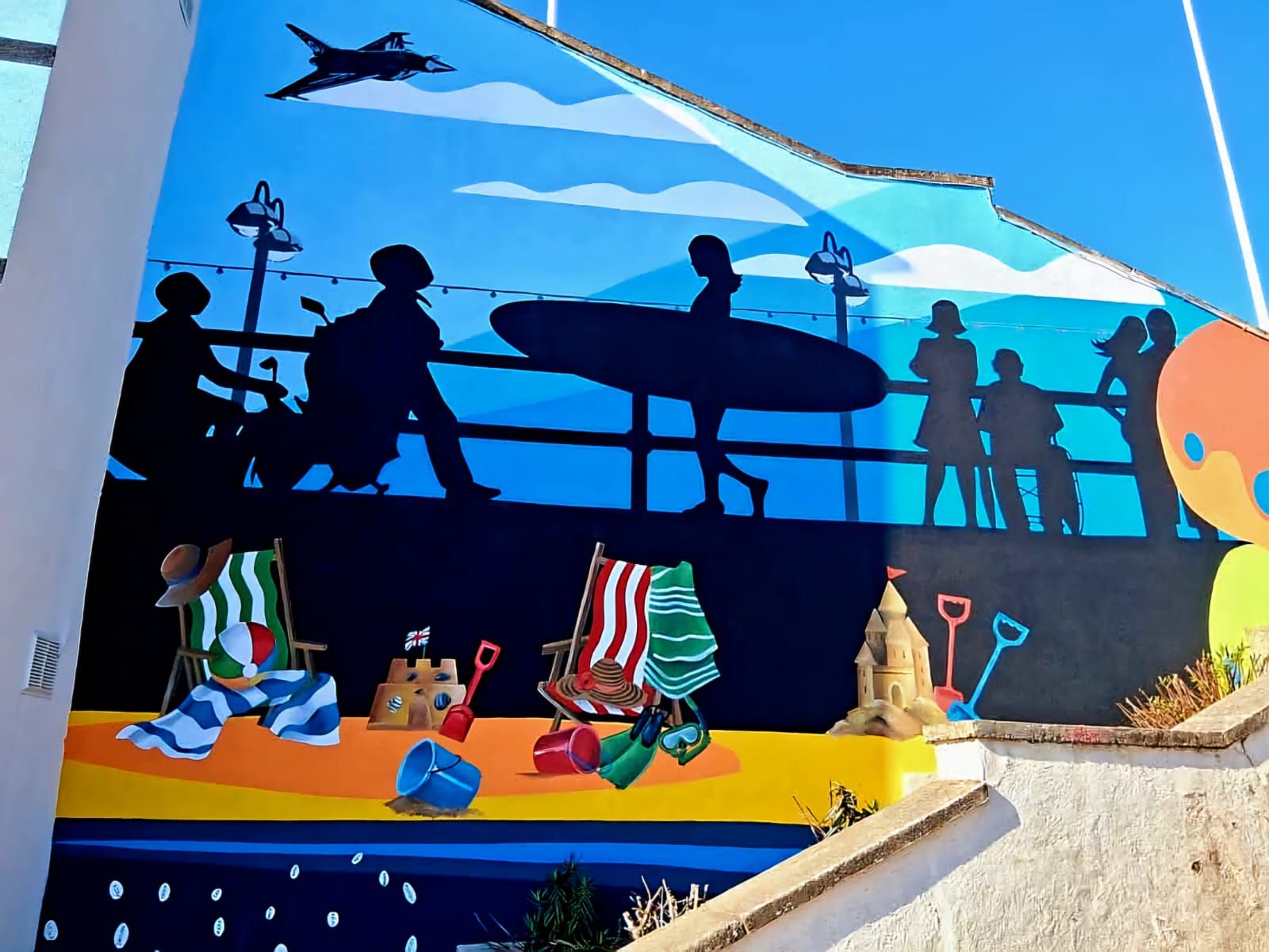 A painting of people sitting on a pier holding surfboards