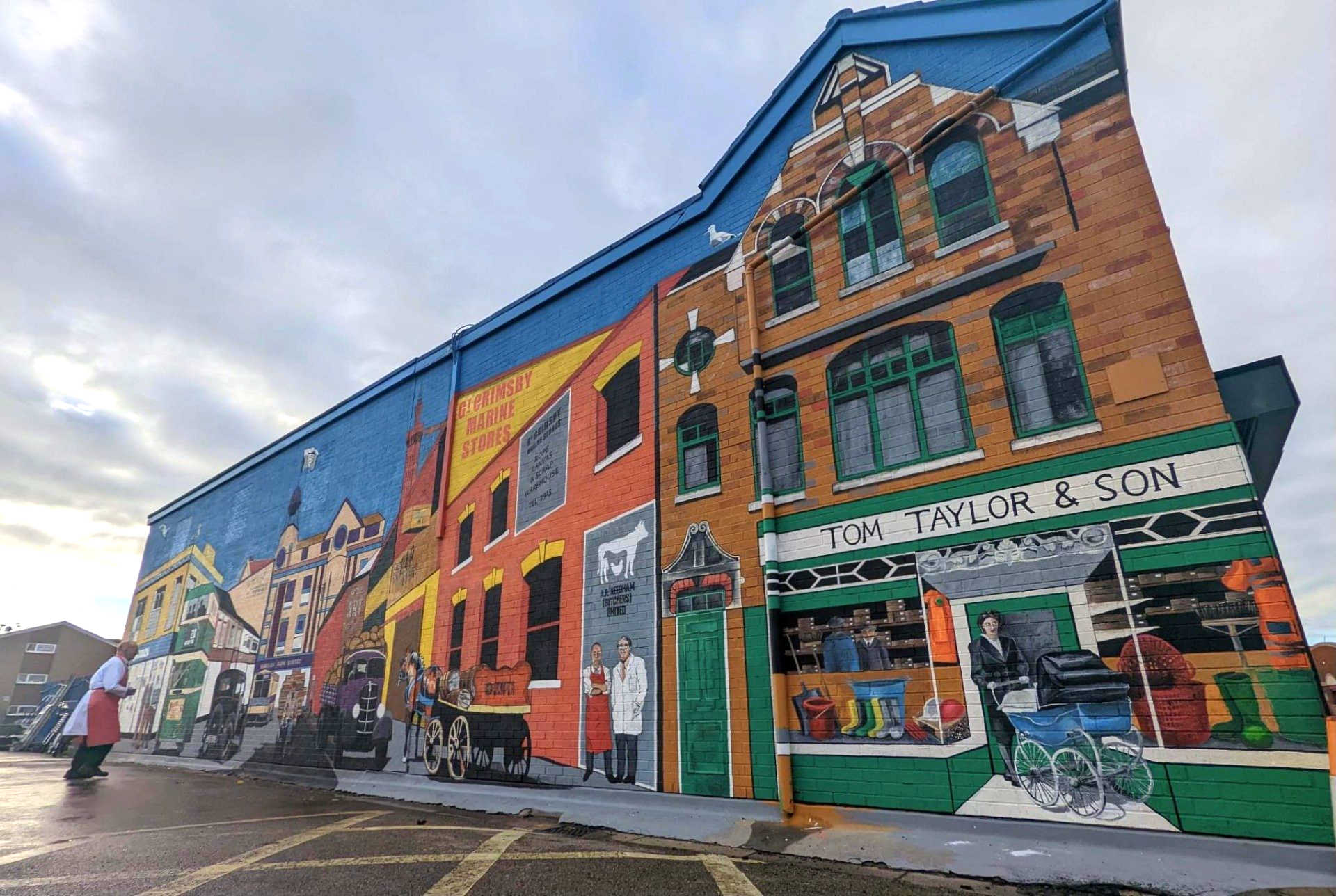 A large building with a mural on the side of it.