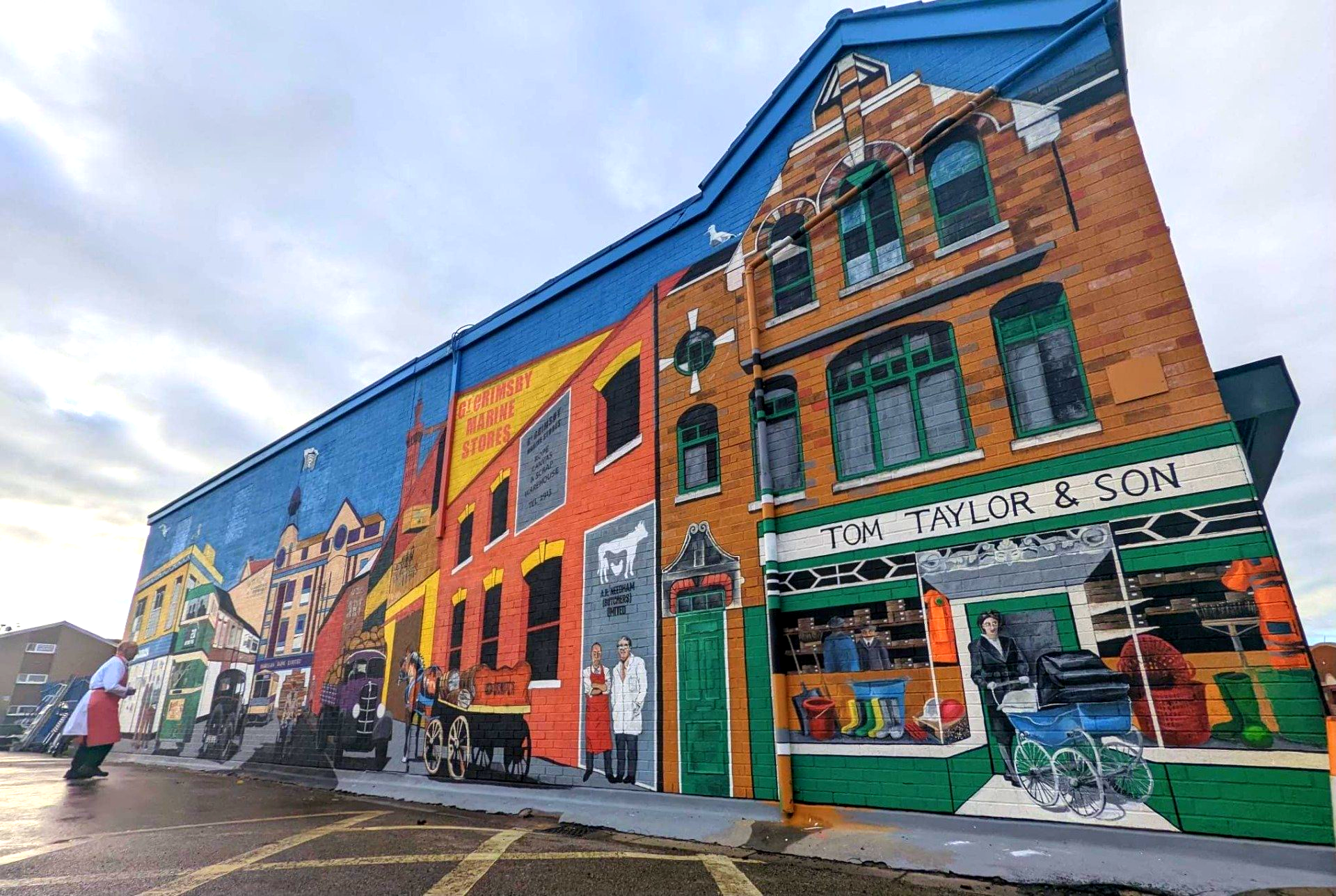 A large building with a mural on the side of it.