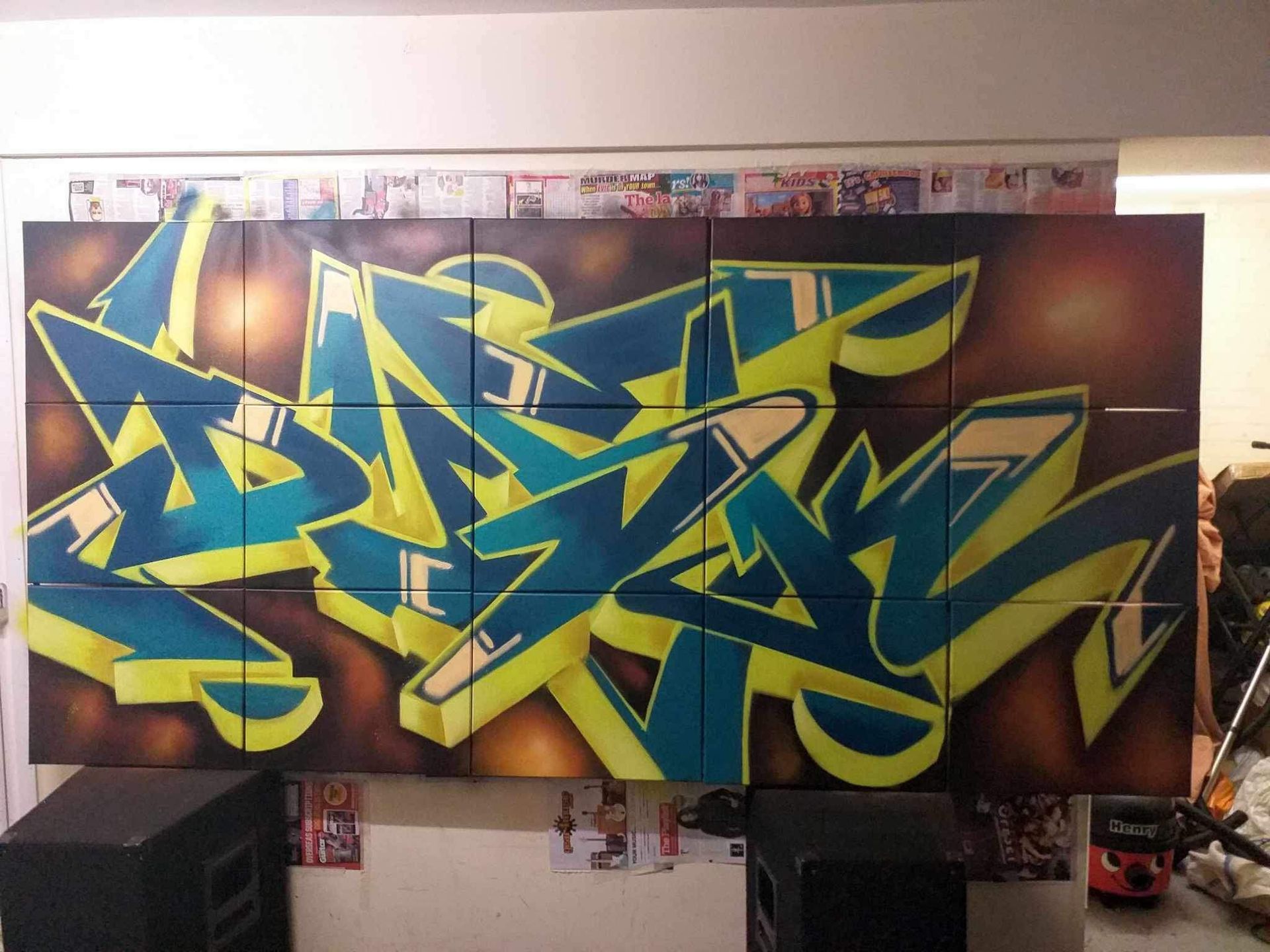 A large piece of graffiti on a wall with the letter a on it