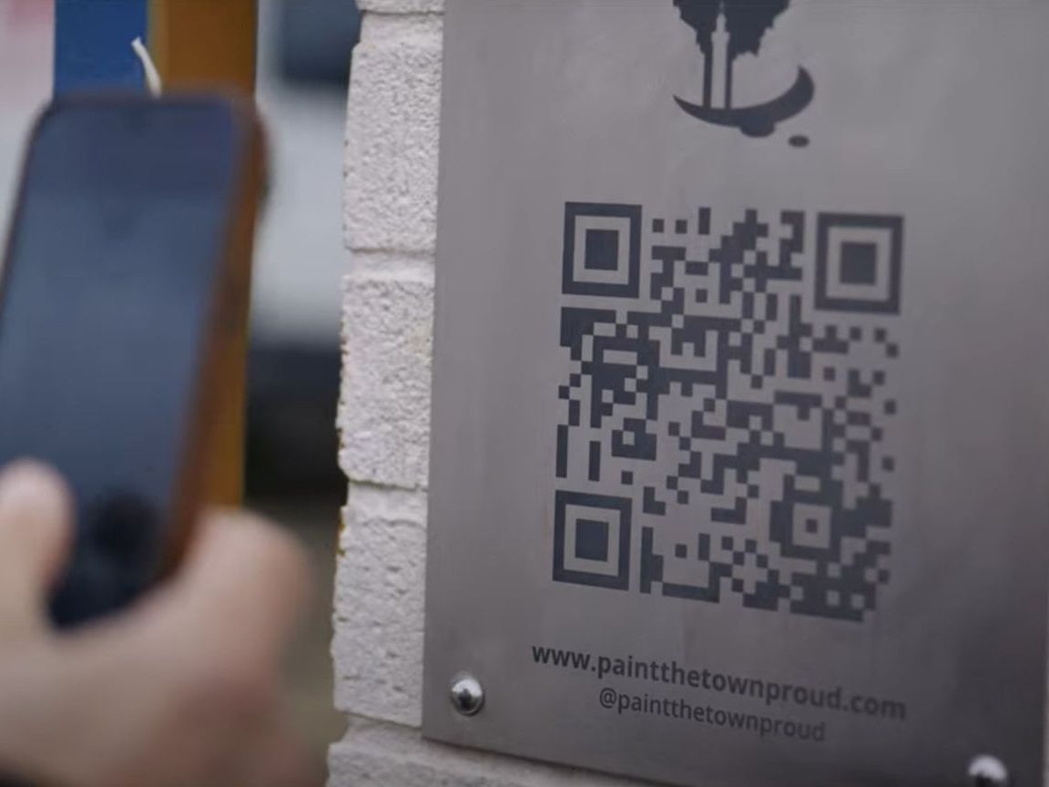 A person is using their phone to scan a qr code