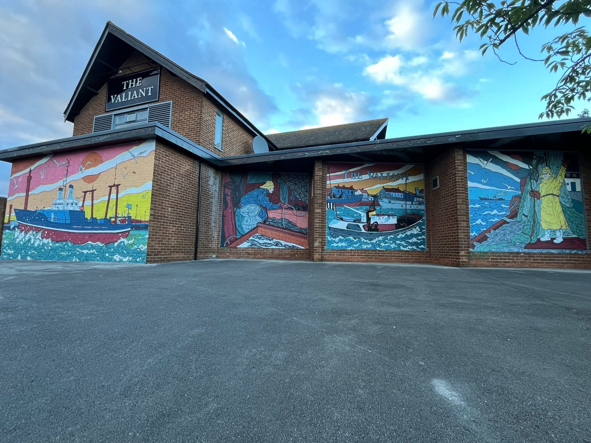 A large building with a mural on the side of it.