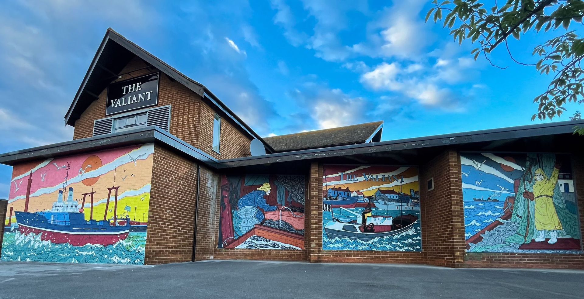 A building with a large mural on the side of it.