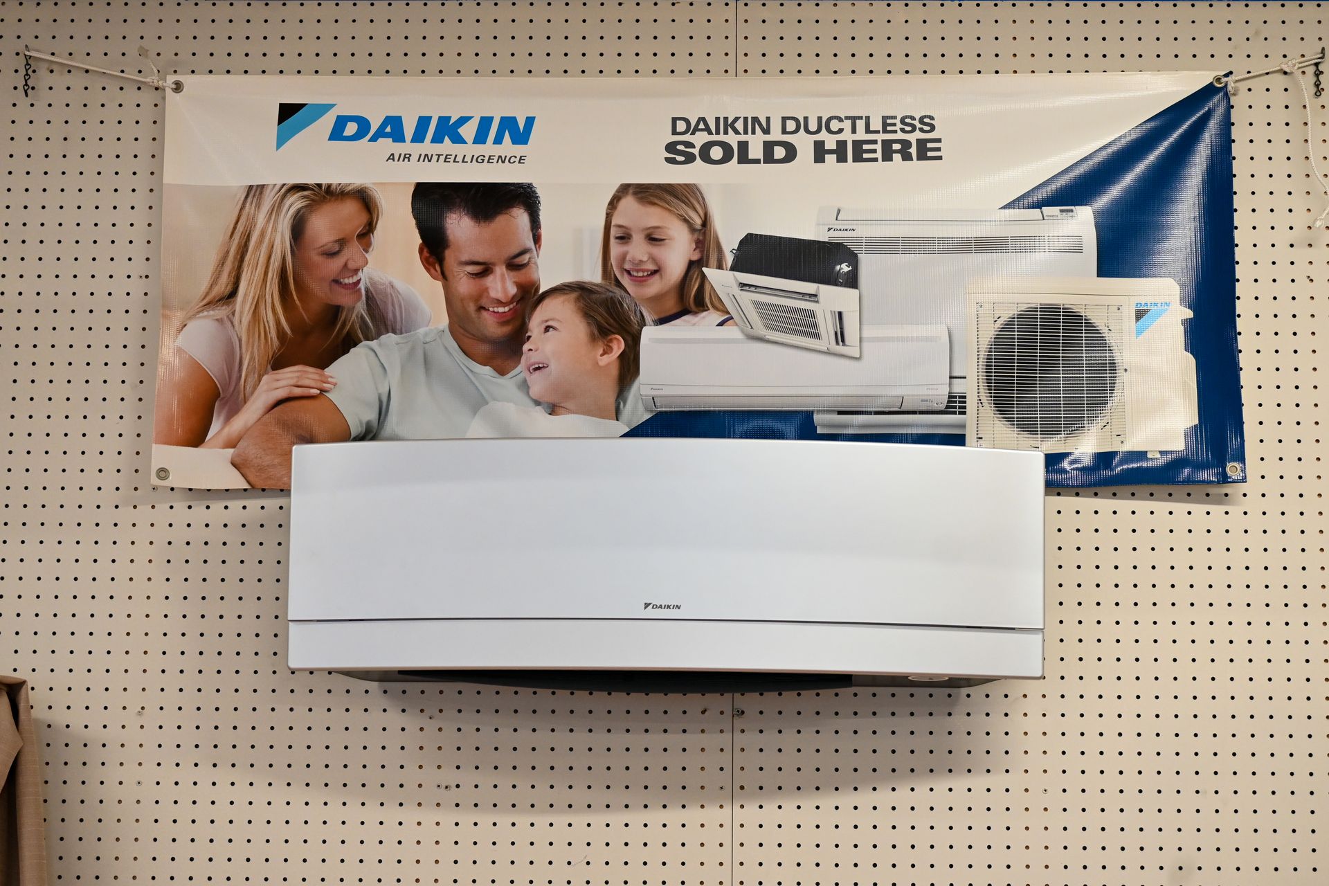 A daikin ductless air conditioner is hanging on a wall