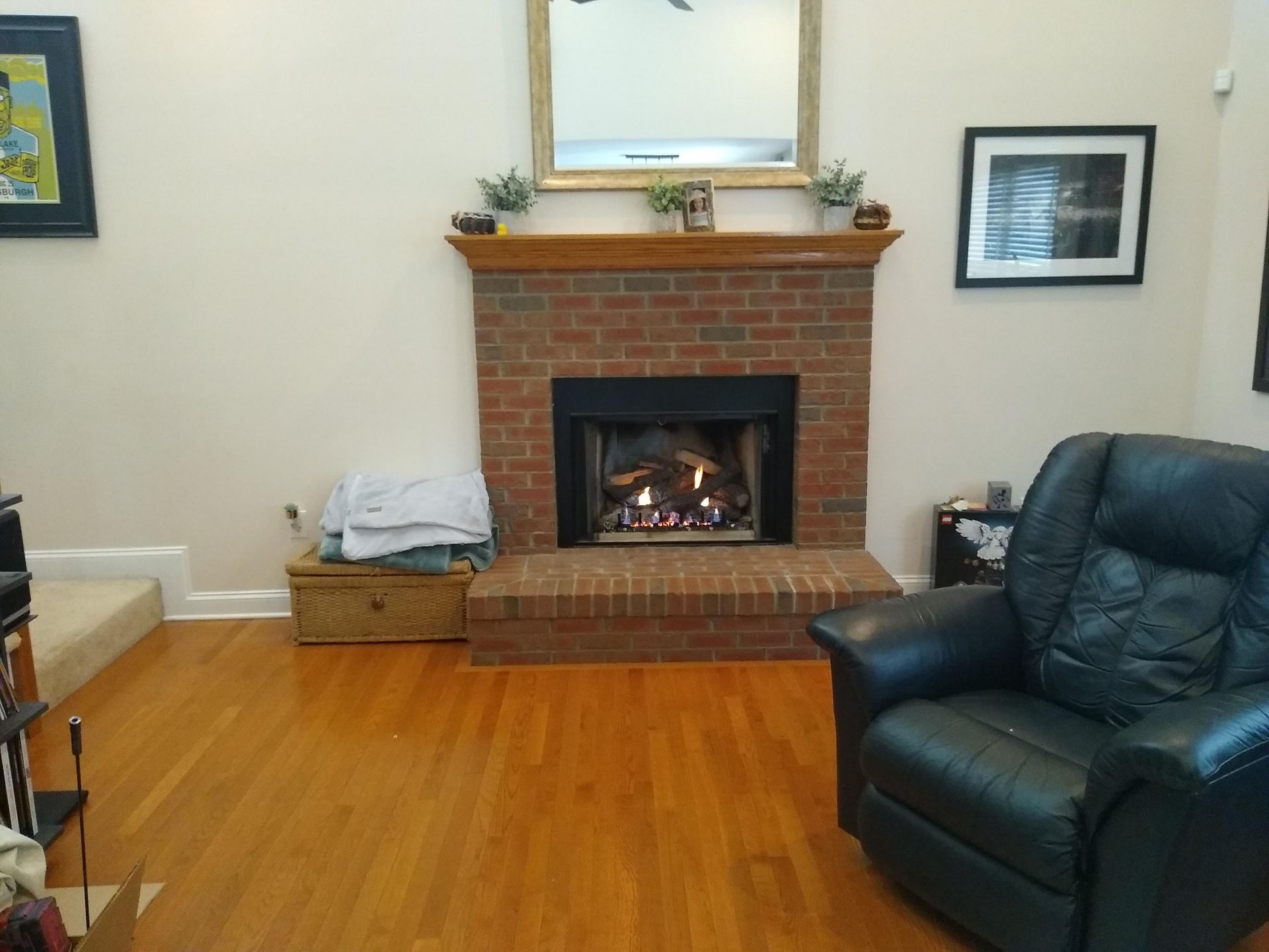 A living room with a fireplace and a chair