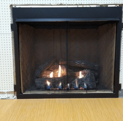 A fireplace with a lot of logs in it