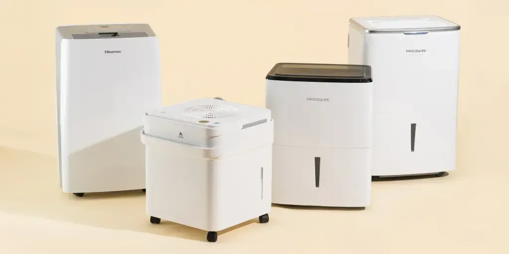 A group of air purifiers are sitting next to each other on a table.