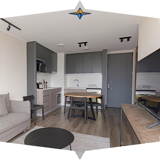 A family is posing for a picture while sitting on a couch.