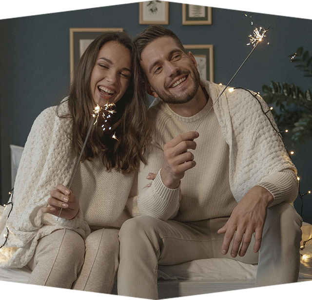A man and a woman are dancing in a kitchen