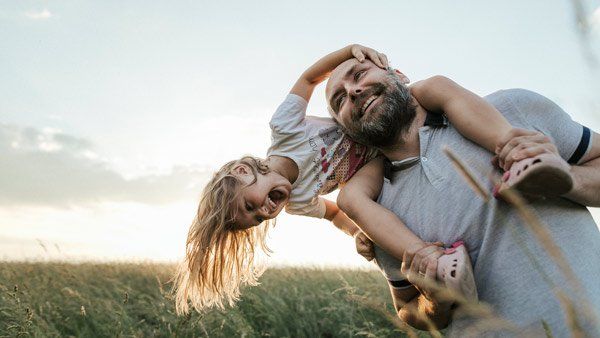 smiling man and daughter