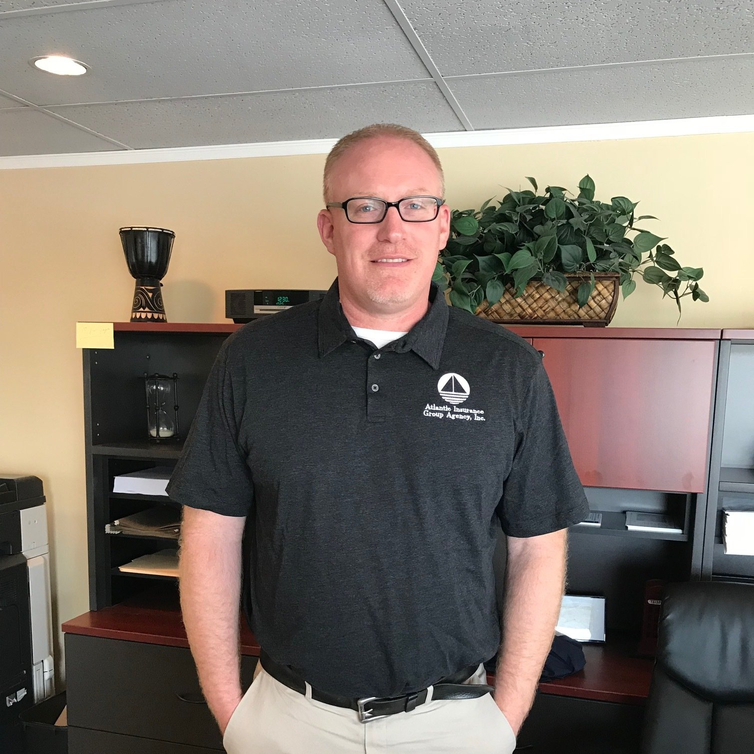 lee standing in front of his desk