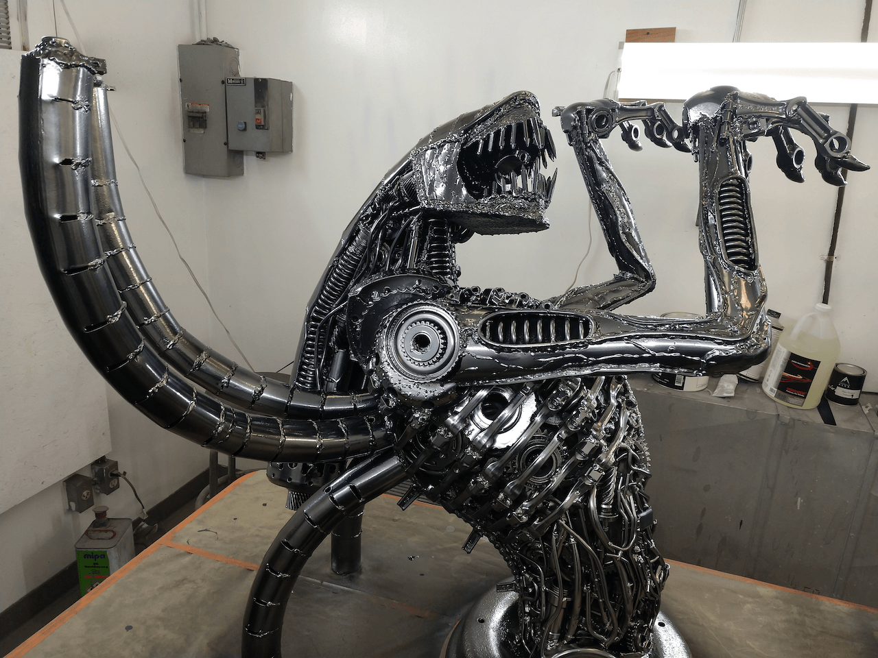 A statue of an alien is sitting on a table