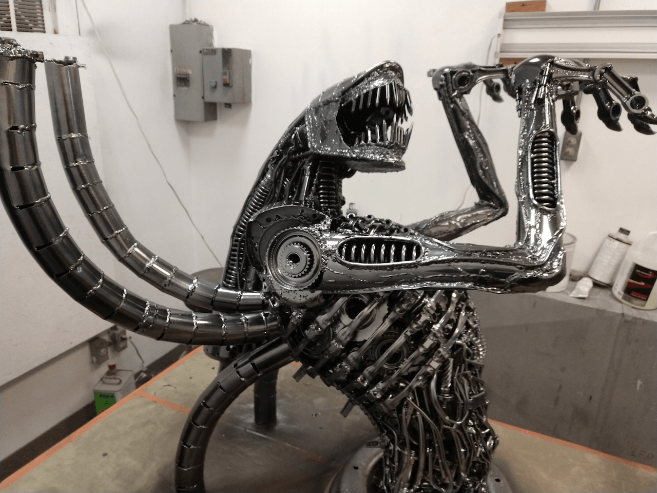 A statue of an alien is sitting on a table