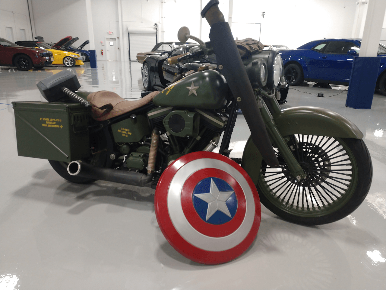 A motorcycle with a captain america shield on it