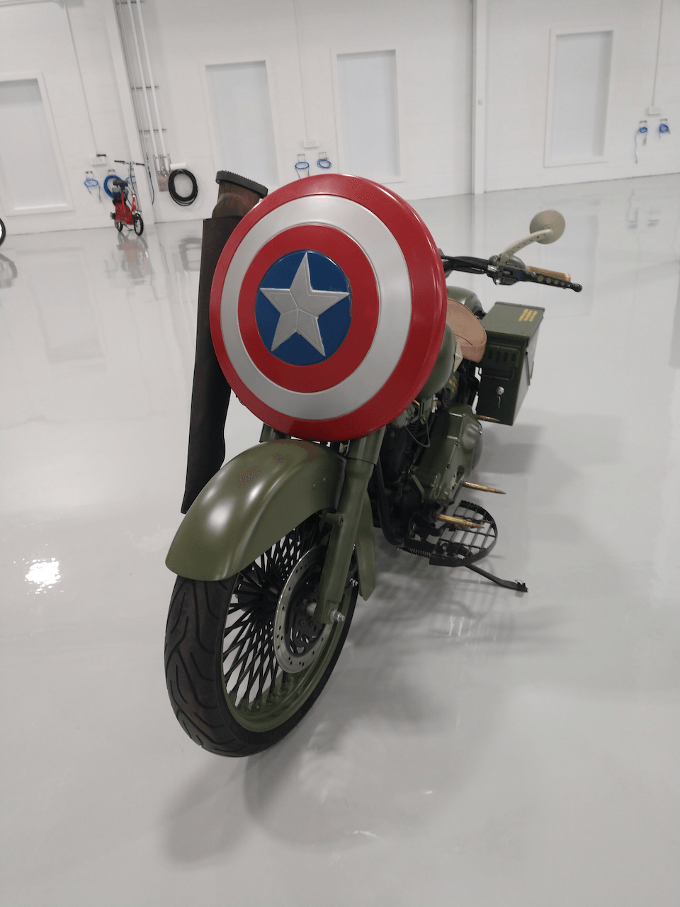 A motorcycle with a captain america shield on it