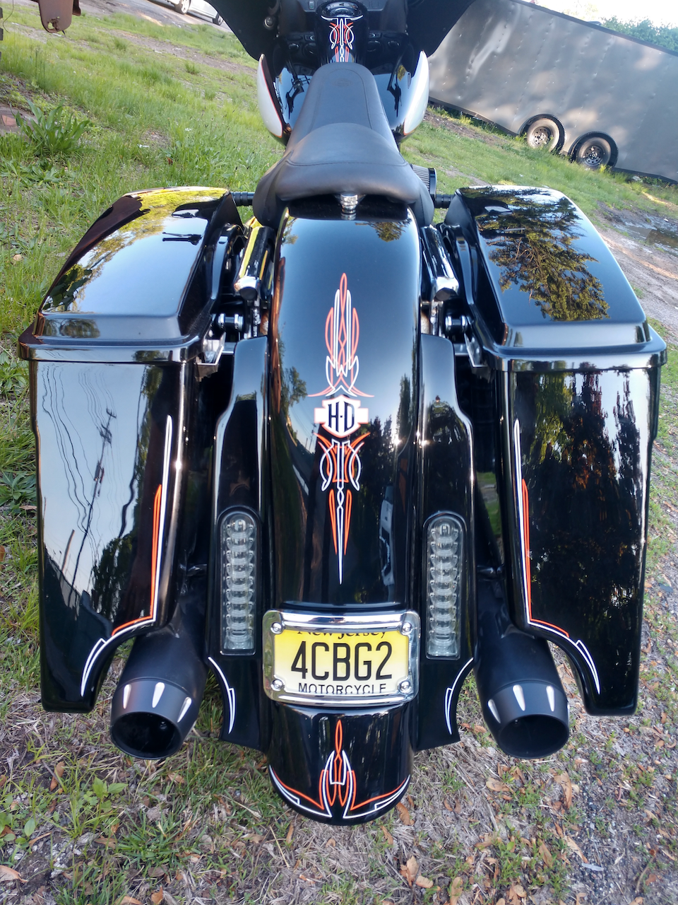 A black motorcycle with a license plate that says 4cbg2